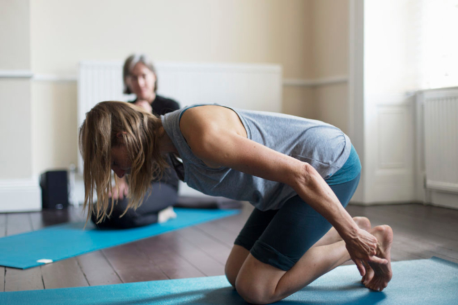 Caroline Reid, Bristol based Scaravelli-inspired yoga teacher, preparing for Downward Dog Pose
